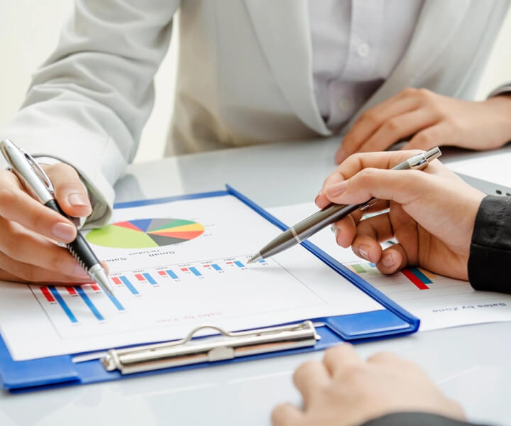 Young Business People Working and Calculating About Finance With Strategy Graph Chart Report